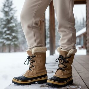 Sorel Tan and Black Winter Boots.